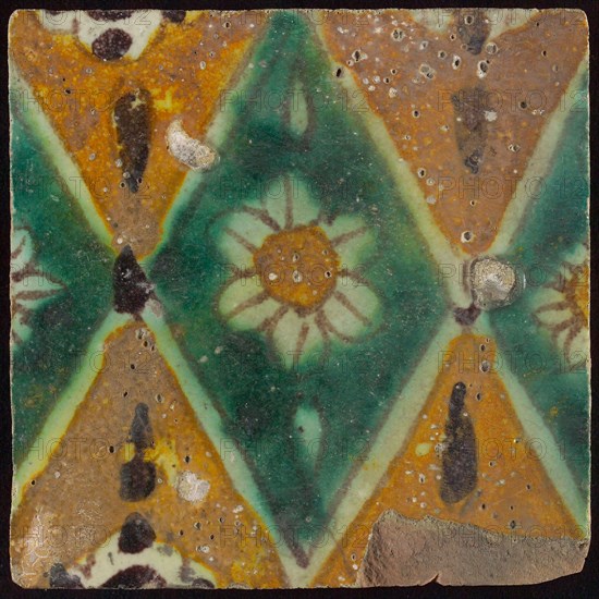 Floor tile, brown draft, green and yellow on white ground, central green oblique glass in which white flower with yellow heart