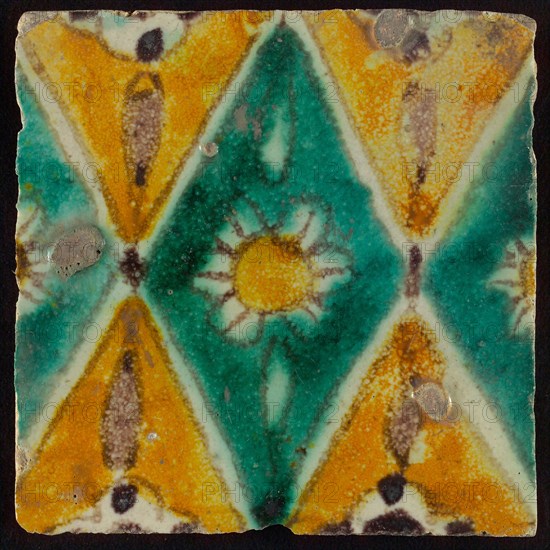 Floor tile, brown draft, green and yellow on white ground, central green oblique glass in which white flower with yellow heart