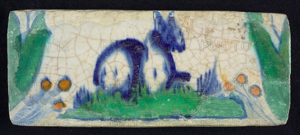 Border tile, blue, yellow and green, lying animal, hare?, edge tile wall tile tile sculpture ceramics pottery glaze, baked 2x