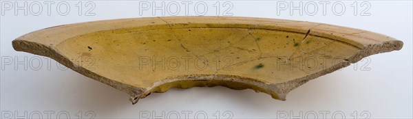 Fragment deep, yellow dish on pinched stand ring, white shard, plate dish crockery holder soil find ceramic earthenware glaze