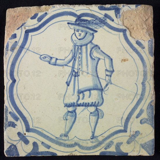 White tile with blue warrior in accolade-shaped frame; corner motif wing leaf, wall tile tile sculpture ceramic earthenware