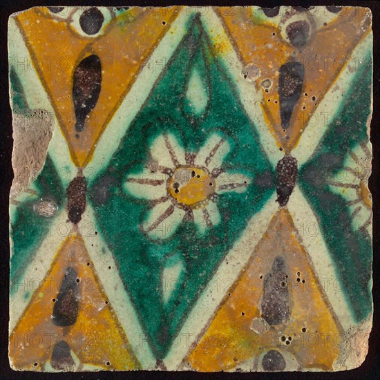 Floor tile, brown draft, green and yellow on white ground, central green oblique glass in which white flower with yellow heart