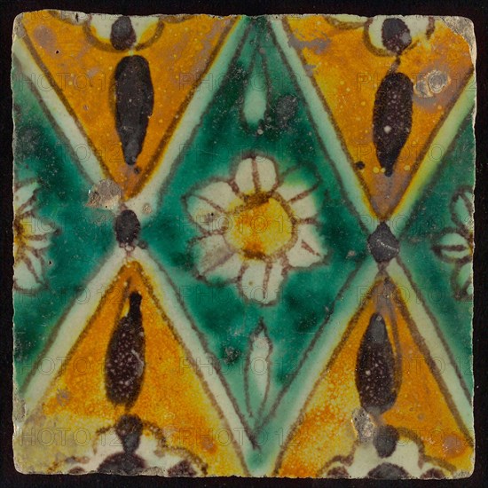 Floor tile, brown draft, green and yellow on white ground, central green oblique glass in which white flower with yellow heart