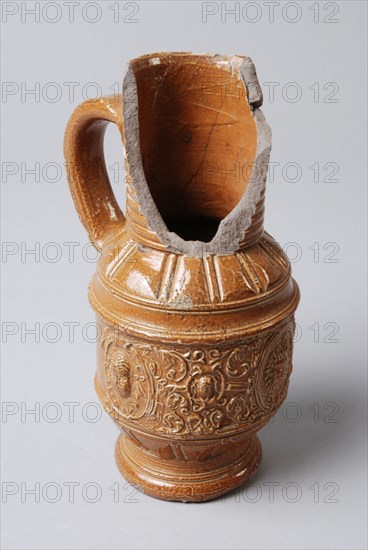 Small, brown stoneware jug with fries over the belly, jug crockery holder soil find ceramic stoneware clay engobe glaze salt