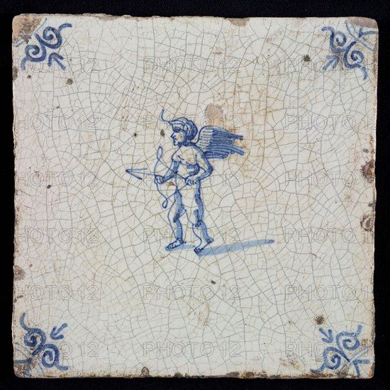 White tile with blue cupid with bow and arrow; corner pattern ox head, wall tile tile sculpture ceramic earthenware glaze, baked