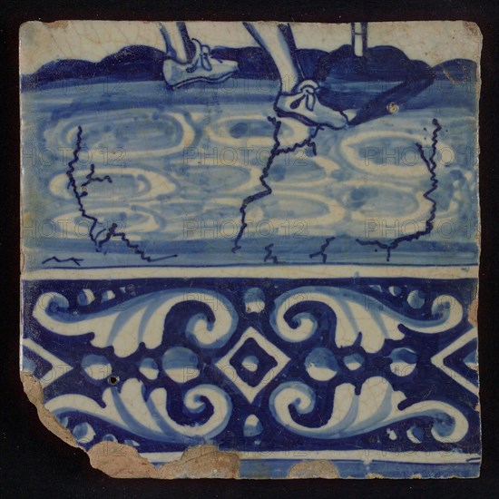 Tile of tableau with in blue feet and decorated border, tile picture footage fragment ceramic pottery glaze, baked 2x glazed