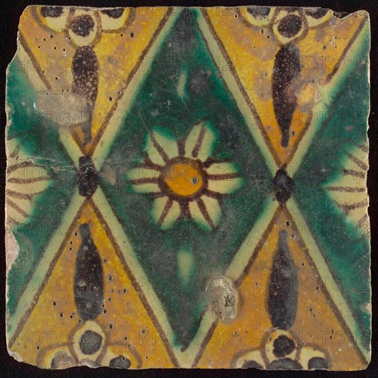 Floor tile, brown draft, green and yellow on white ground, central green oblique glass in which white flower with yellow heart