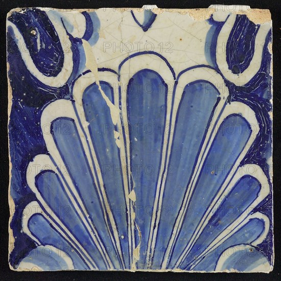 Tile of chimney pilaster, blue on white, shell-like headdress, chimney pilaster tile pilaster footage fragment ceramic