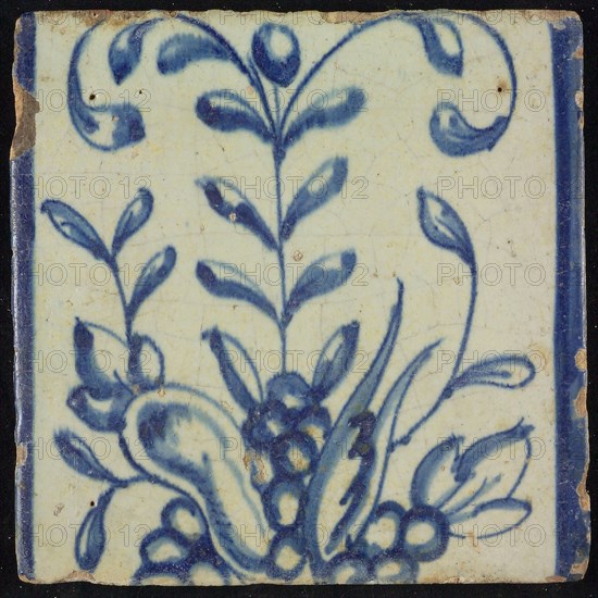 Tile of chimney pilaster, blue on white, part of up and down continuous representation with fruits and branches, chimney