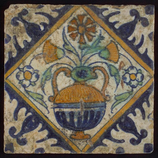 Tile, orange, brown, green, and blue on white, flowerpot in square, corner pattern palmet, wall tile tile sculpture ceramic