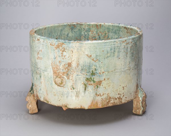 Tripod Cylindrical Jar (Lian or Zun), Eastern Han dynasty (25–220 A.D.), 2nd century, China, Earthenware with green lead glaze, H. 22.0 cm (8 11/16 in.), diam. 31.1 cm (12 1/4 in.)