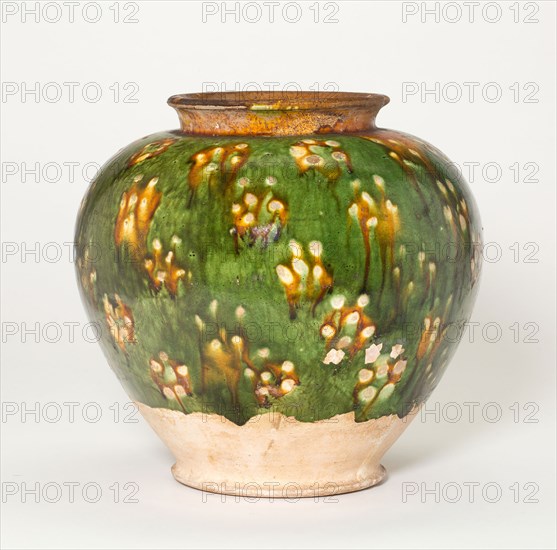 Ovoid Jar with Blossom-Like Spotting, Tang dynasty (618–906), first half of 8th century, China, Earthenware with three-color (sancai) lead glazes and resist decoration, H. 16.5 cm (6 1/2 in.), diam. 17.4 cm (6 13/16 in.)