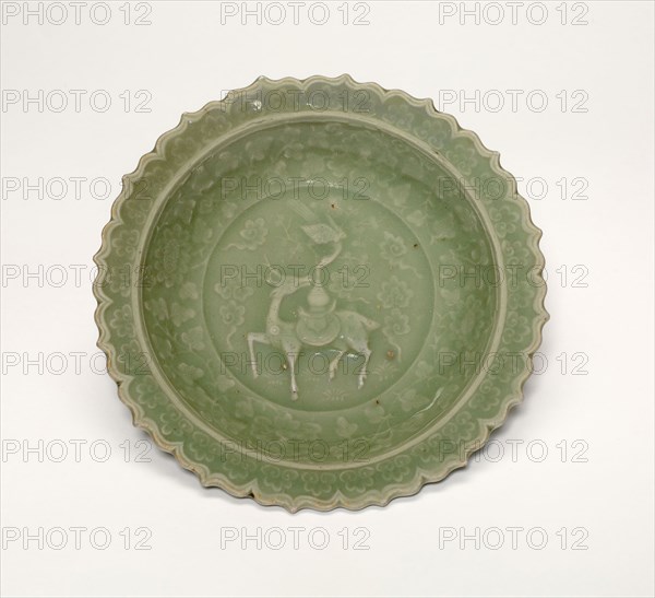 Foliate Dish with Crane and Deer Amid Clouds, Yuan dynasty (1279–1368), late 13th century, China, Longquan ware, celadon-glazed stoneware with underglaze mold-impressed decoration, H. 3.5 cm (1 3/8 in.), diam. 15.2 cm (6 in.)