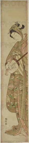 Woman Playing the Shamisen, c. 1769, Suzuki Harunobu ?? ??, Japanese, 1725 (?)-1770, Japan, Color woodblock print, hashira-e, 24 3/4 x 4 3/4 in.
