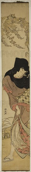 Woman under Windblown Wisteria, c. 1780, Torii Kiyonaga, Japanese, 1752-1815, Japan, Color woodblock print, hashira-e, 70.4 x 11.9 cm