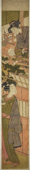 Women Holding Boy who is Reaching Out to Young Man Below, c. 1776, Attributed to Kitao Shigemasa, Japanese, 1739-1820, Japan, Color woodblock print, hashira-e, 28 3/4 x 4 1/2 in.