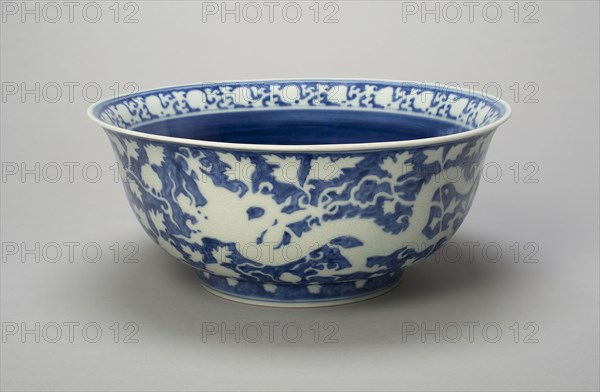Bowl with Dragons, Peony Scrolls, and Band of Lingzhi Mushrooms, Ming dynasty (1368–1644), Jiajing reign mark and period (1522–1566), China, Porcelain painted in underglaze blue with design in reserve, H. 11.8 cm (4 5/8 in.), diam. 28.5 cm (11 1/4 in.)