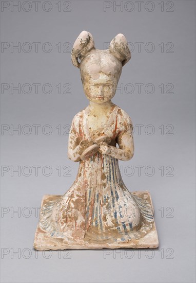 Female Musician, Tang dynasty (A.D. 618–907), late 7th/early 8th century, China, Earthenware with polychrome pigments, 21.4 × 13.6 × 13.2 cm (8 7/16 × 5 3/8 × 5 3/16 in.)