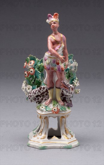 Figure of America, c. 1766, Bow Porcelain Factory, London, England, 1744-1775, Bow, Soft-paste porcelain, polychrome enamels and gilding, 14.3 × 5.4 × 5.4 cm (5 5/8 × 2 1/8 × 2 1/8 in.)