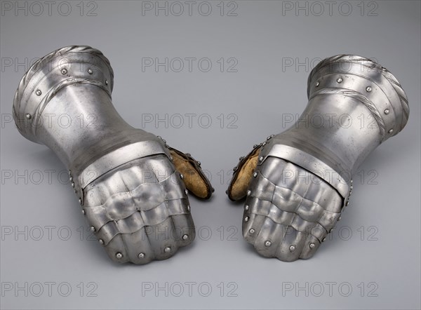 Pair of Mitten Gauntlets, c. 1520 with modern restorations, Flemish, Flanders, Steel and leather, Each 26.7 cm (10 1/2 in.)