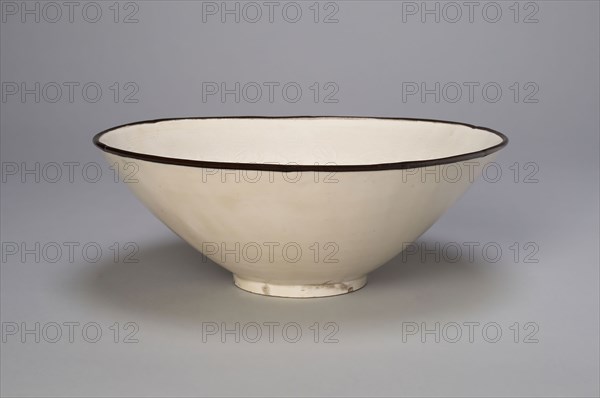 Bowl with Boys Playing amid Peony Blossoms, Jin dynasty (1115–1234), 12th century, China, Ding ware, porcelain with underglaze molded decoration, metal rim, H. 6.4 cm (2 1/2 in.), diam. 21.0 cm (8 1/4 in.)