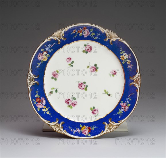 Plate, 1771, Sèvres Porcelain Manufactory, French, founded 1740, Sèvres, Soft-paste porcelain, dark blue ground, polychrome enamels, and gilding, Diam. 24.8 cm (9 3/4 in.)