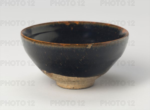 Bowl with Striated Petals, Song (960–1279) or Jin dynasty (1115–1234), c. 12th/13th century, China, Northern blackware, Cizhou type, stoneware with traces of overglaze silver or powdered gold decoration, H. 5.4 cm (2 1/8 in.), diam. 11.7 cm (4 5/8 in.)