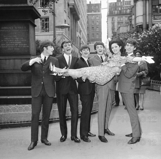 John Lennon Paul McCartney George Harrison and Ringo Starr with Billy J Kramer and Susan Maughan celebrate their success at Victoria Embankment Gardens in before a lunch at the Savoy to celebrate the Variety Club's awards London 10 September 1963