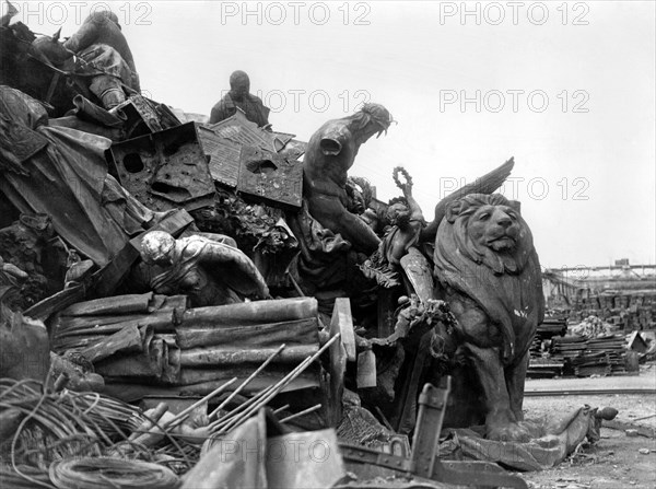 War salvage: Pictures taken in a German smelting yard at Hamburg which shows the shortage of German metal for Munitions. Here are Bronze statues and Church Bells collected from occupied countries piled in a heap ready for smelting irrespective of there value the end of the war may save some of the more valuable ones. June 1945. June 1945 P010153