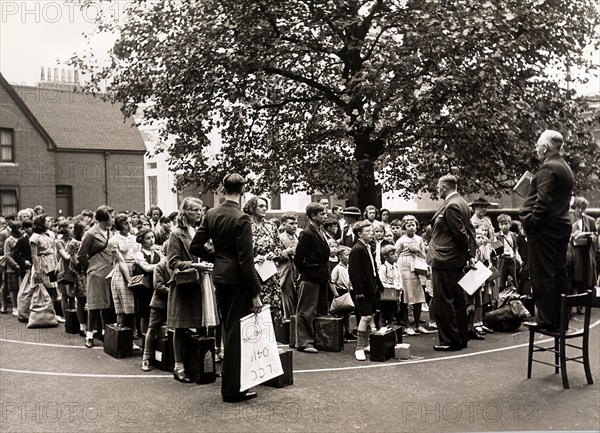 Headmaster Mr Rixon gives last minute instructions to children at St Michaels Church School, Buckingham Palace Road for their evacuation the next day