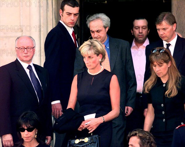 Princess Diana leaves a memorial service for slain Italian fashion designer Gianni Versace at Milan's Gothic Roman Catholic cathedral, one week after the Italian designer was gunned down outside his Miami Beach home. 
The service was attended by around 2000 people including family members and scores of international celebrities.
The Princess is wearing a Versace black shift-dress and holding a leather Kelly bag with Medusa heads, re-named “the Diana bag”.
22nd July 1997.