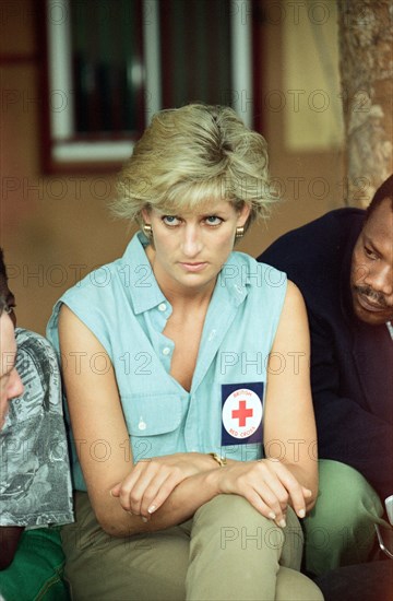 Diana, Princess of Wales during her four day visit to Angola, the former Portuguese colony torn apart by 20 years of bloody civil war, on a British Red Cross mission to highlight the evil of land mines. The Princess poses with amputees at the the Neves Bendinha Orthopedic Workshop on the outskirts of Luanda on the second day of her visit. 14th January 1997.