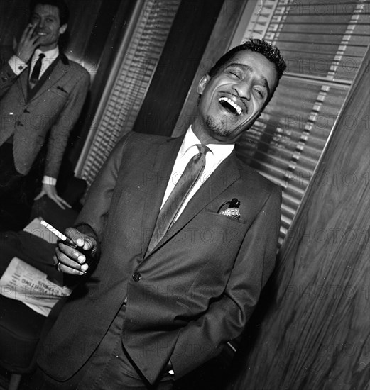 Sammy Davis Jnr at a press reception in Soho cinema showing slips of his new film Robin and his hood men.
10th March 1964.
S2200