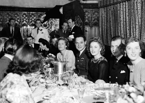 Douglas Bader and his wife at party, following the liberation of Colditz, where he was a POW.  29th May 1945.