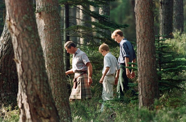 Prince Charles with sons Prince William and Prince Harry. Pictured on the banks of the River Dee at an official photocall at Balmoral, Scotland. 12th August 1997.