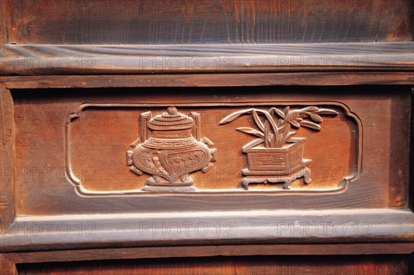 Wood-carved doorhead of traditional dwelling of Tianshui