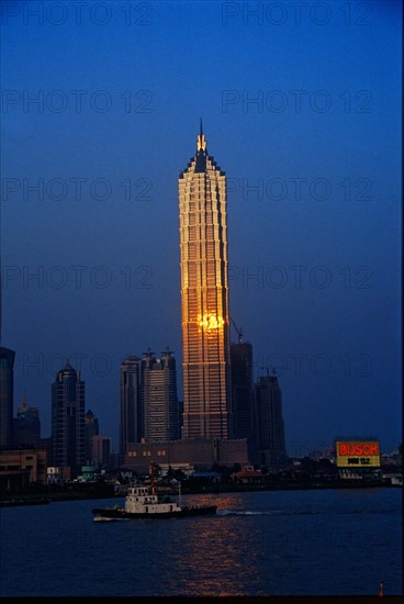 The sun reflected on the windows of Jinmao building at sunset, shanghai,China