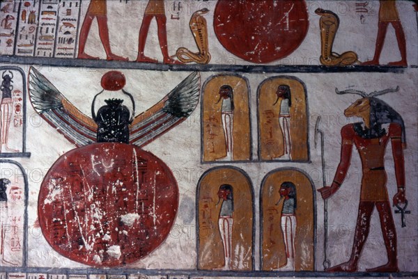 Tomb of Ramses VI. Ram-headed god standing before four chapels with a mummy "the body of Osiris and Geb", and a large disk out of which is coming a winged scarab