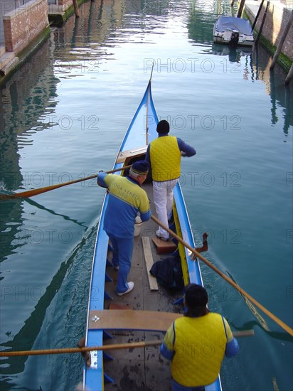 Yellow and blue gondola on Rio San Trovaso in Venice