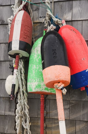 Buoys on a wall in Maine.