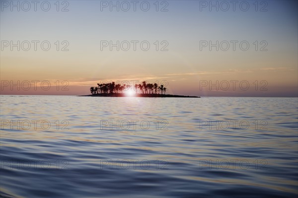 Sunset over tropical island.