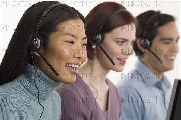 Phone operators using headsets.