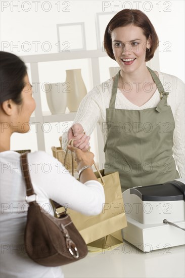 Shopkeeper with customer.