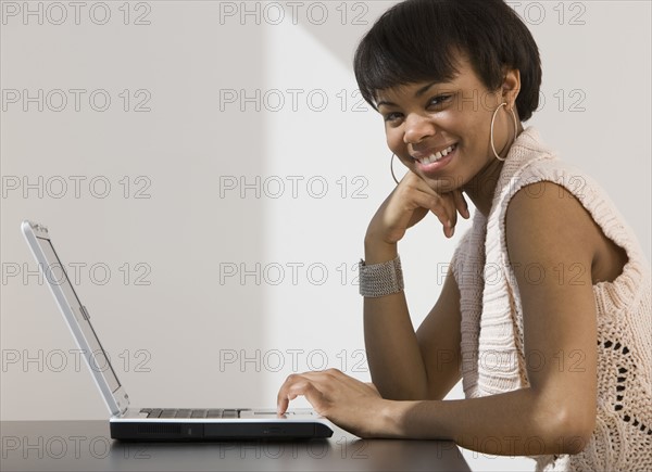 African woman with laptop.