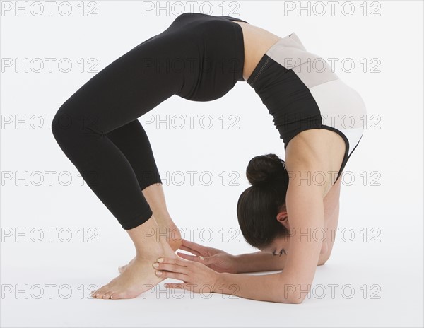 Woman practicing yoga.