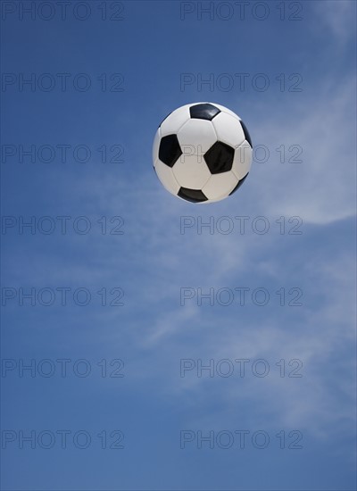 Soccer ball in air.