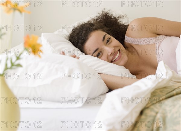 Woman laying in bed. Date : 2007
