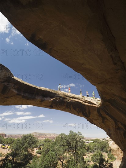 People walking on rock formation. Date : 2007