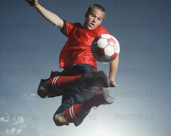 Low angle view of soccer player jumping. Date : 2007