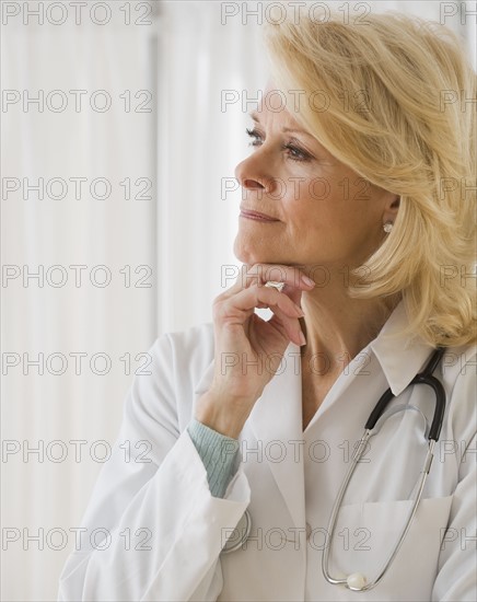 Female doctor thinking .